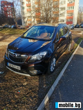     Opel Mokka ~25 000 .