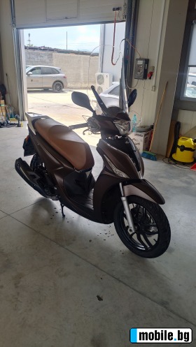     Kymco People 125i ABS ~4 000 .