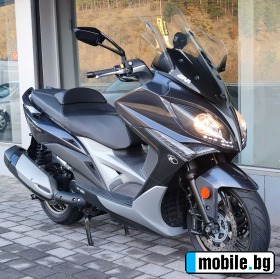    Kymco Xciting 400I ABS ~6 900 .