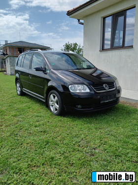     VW Touran ~5 600 .