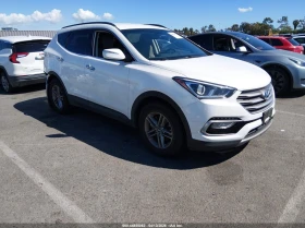 Hyundai Santa fe 2.4L I-4 DI, DOHC, VVT, 185HP Front Wheel Drive
