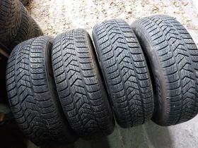 Гуми Зимни 215/65R17, снимка 1 - Гуми и джанти - 48653386