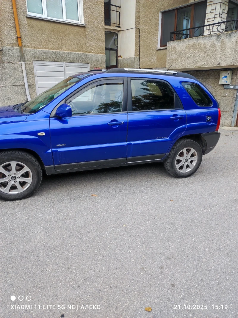 Kia Sportage 2.0 , снимка 11 - Автомобили и джипове - 52583326