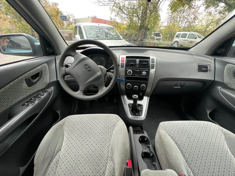 Hyundai Tucson 2.0 CRDI 4x4, снимка 13 - Автомобили и джипове - 52333811