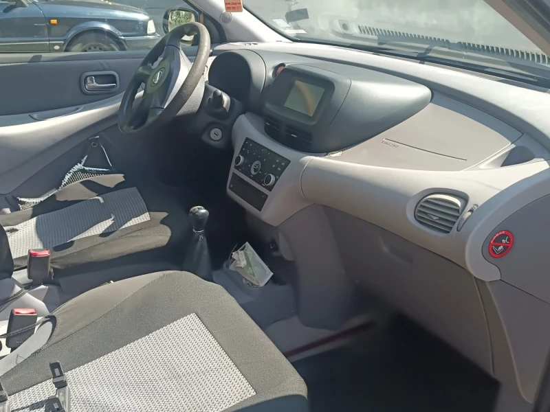 Nissan Almera tino, снимка 7 - Автомобили и джипове - 52454052