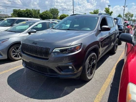 ������ Jeep Cherokee