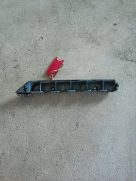 Водач предна броня ляв Сааб 9-3 (1)