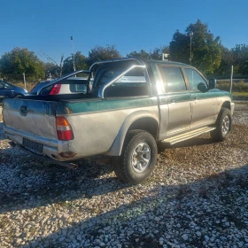 Обява за продажба на Mitsubishi L200 2.5tdi Клима ~9 300 лв. - изображение 5 | Auto.bg Обява за продажба на Mitsubishi L200 2.5tdi Клима ~9 300 лв. - изображение 5