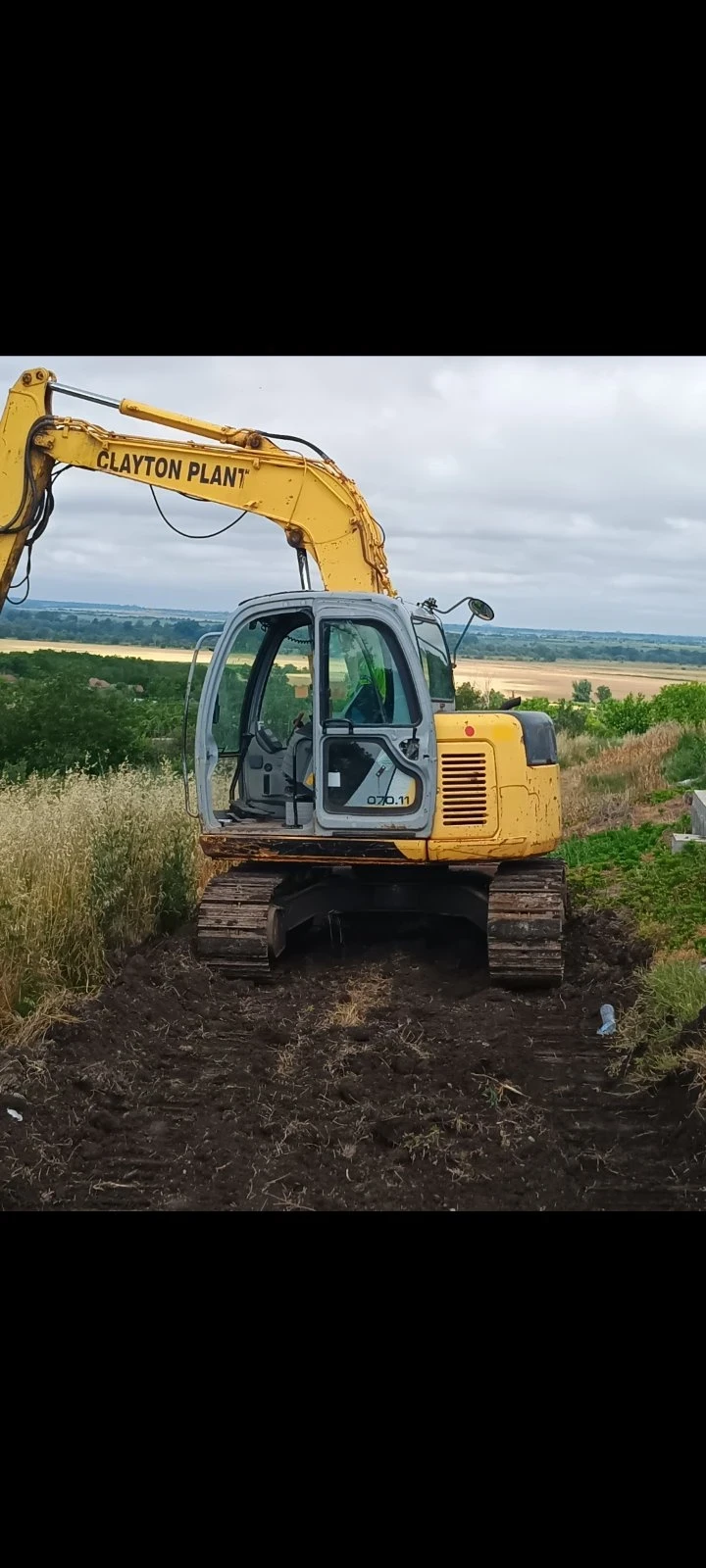 Багер New Holland E70SR