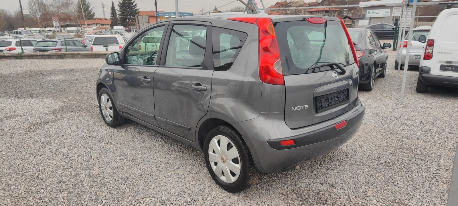 Nissan Note 1, 6-110к.с. - изображение 6