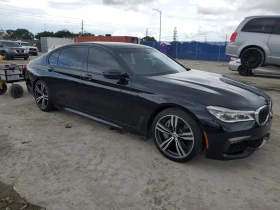 BMW 750 MPACK/FULL/HEADUP/ПАНОРАМА/ОБДУХВАНЕ/MASSAGE - 42600 лв. - 58026627 3