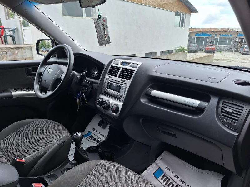 Kia Sportage 2.0i 141kc, снимка 11 - Автомобили и джипове - 47196565