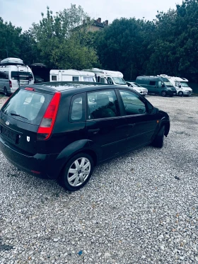 Ford Fiesta 1.4iGhia, Климатик, Нов внос от Германия - 2800 лв. - 37721674 4