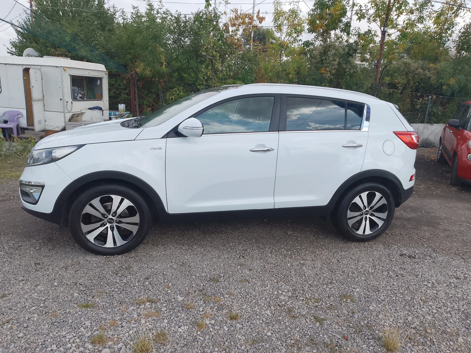 Kia Sportage 2.0 CRDI AWD PREMIUM, снимка 2 - Автомобили и джипове - 56232436