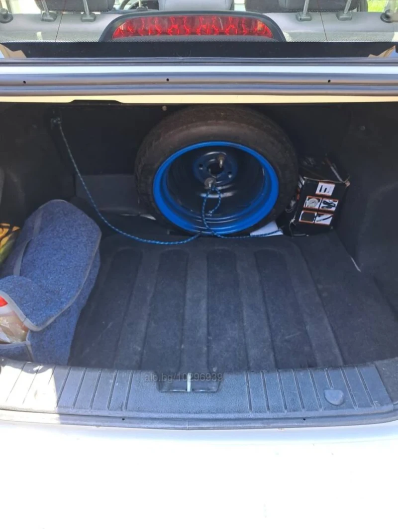 Chevrolet Aveo, снимка 11 - Автомобили и джипове - 52310836