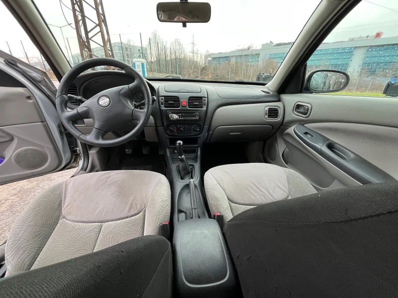 Nissan Almera 1.5i, снимка 11 - Автомобили и джипове - 48310968