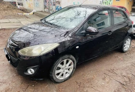 ������ Mazda 2