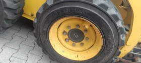 Мини челни товарачи Komatsu Sk714, снимка 6