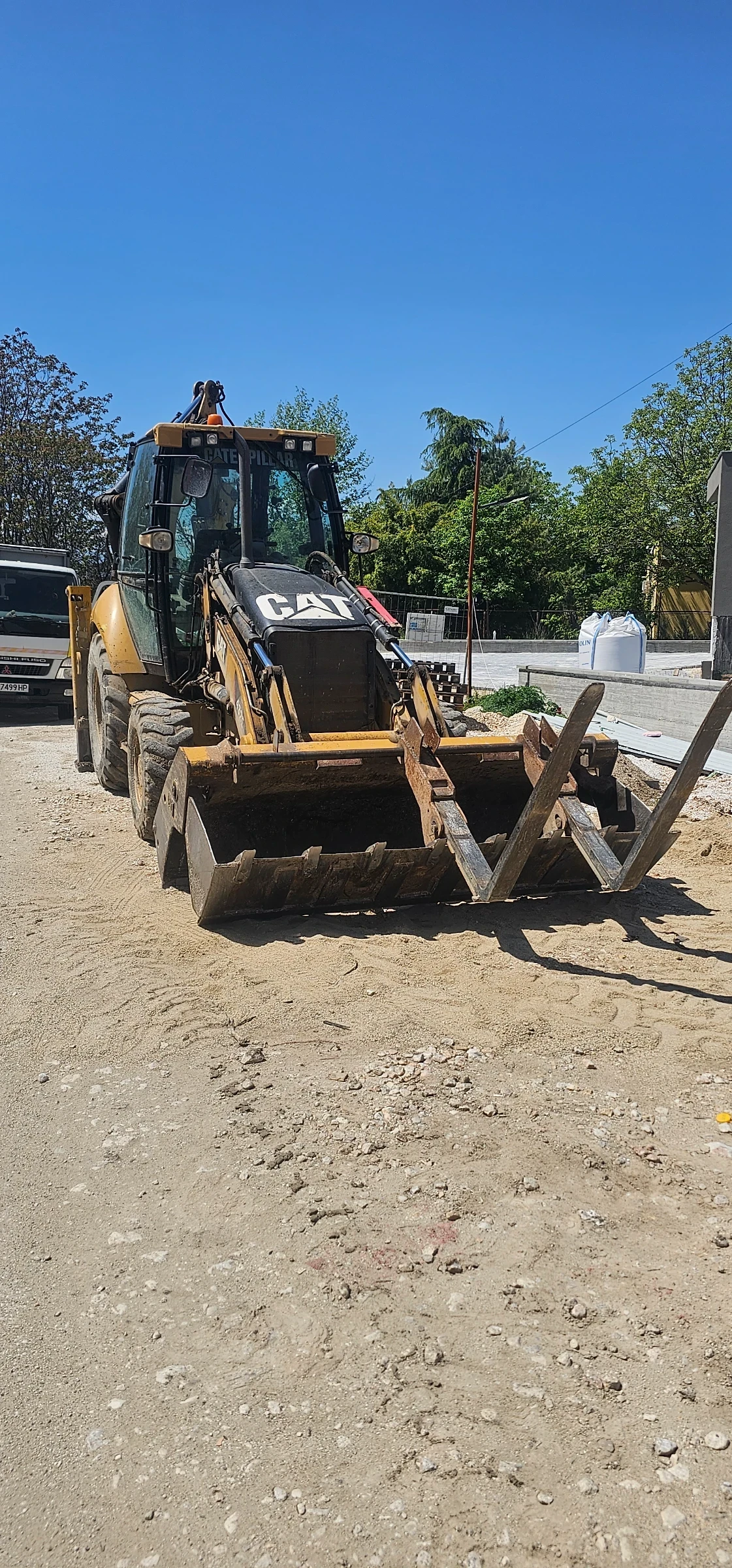 Багер Caterpillar 432E
