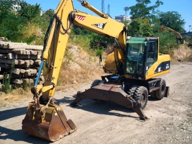 Багер Caterpillar M318C, снимка 1