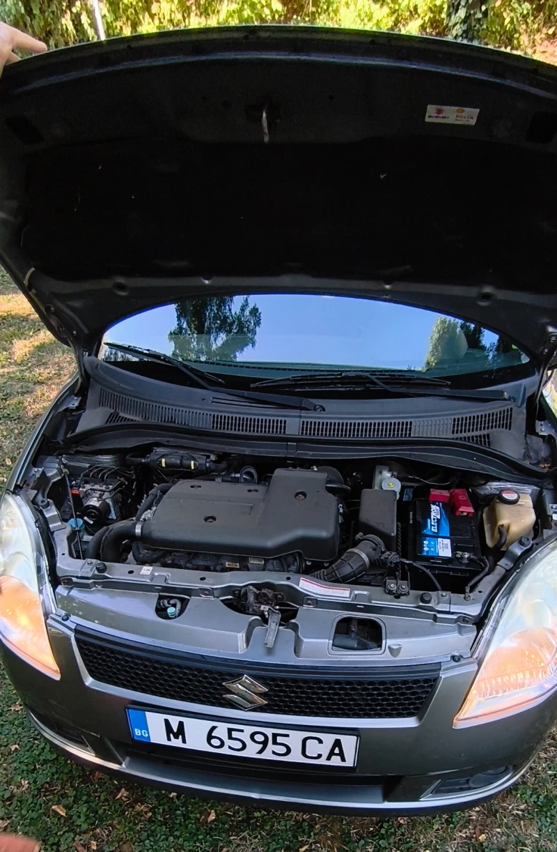 Suzuki Swift 1.3 68 k.с., снимка 11 - Автомобили и джипове - 52499505