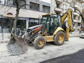 Багер Caterpillar 428E