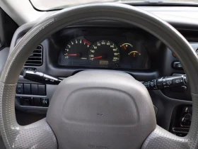 Suzuki Grand vitara 1.6i/4×4/Клима* 97157км!!!! Реални* Теглич* , снимка 14