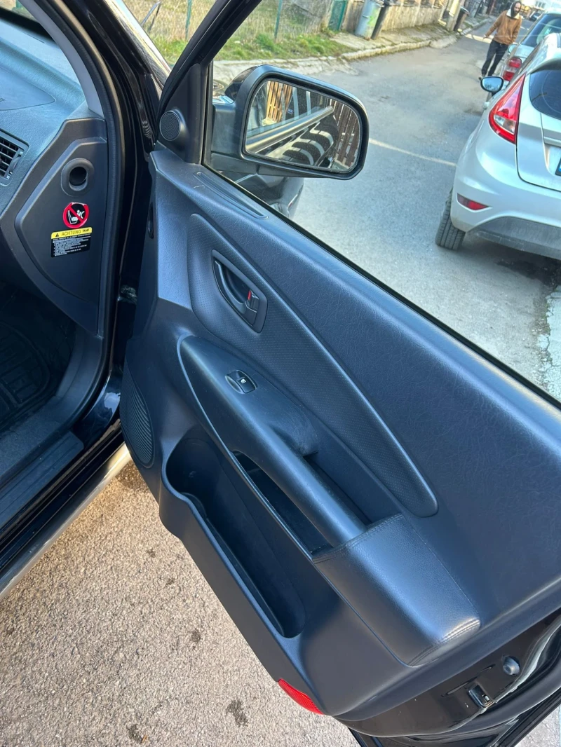 Hyundai Tucson 2.0 газ/бензин, снимка 16 - Автомобили и джипове - 53296357