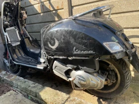     2  Vespa 125i GTS