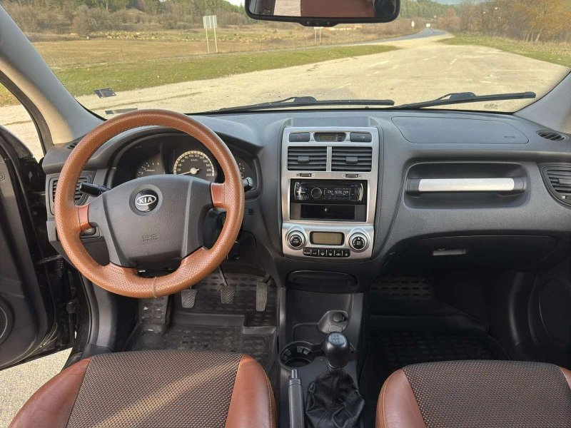 Kia Sportage 2.0 CRDi 4x4, снимка 10 - Автомобили и джипове - 52492543