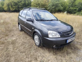 ������ Kia Carens