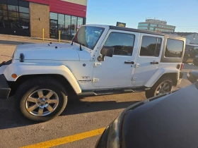 Обява за продажба на Jeep Wrangler * Sahara * CARFAX * БЕЗ ПЪРВОНАЧАЛНА ВНОСКА ~20 350 лв. - изображение 1 | Auto.bg Обява за продажба на Jeep Wrangler * Sahara * CARFAX * БЕЗ ПЪРВОНАЧАЛНА ВНОСКА ~20 350 лв. - изображение 1