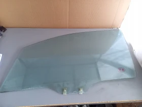 Стъкло предно ляво Мазда Примаси 