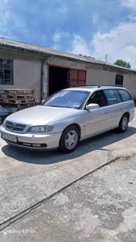 Opel Omega 2.6 V6 Elegance с шпер, LPG, ръчка, кожа, нивомат - 2600 € / 5085.16 лв. - 84959507 17
