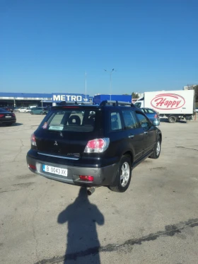 Mitsubishi Outlander 2.4i 4x4 - 3400 лв. / 1738.39 € - 22244326 6