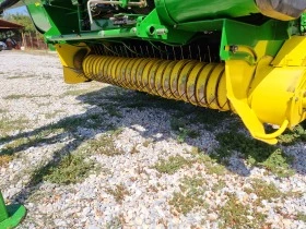      John Deere 582 + 