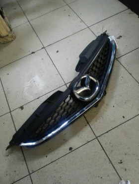 Решетка между фарове Мазда 5 2.0д