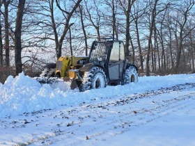 Телескопични товарачи Caterpillar TH 407, снимка 2
