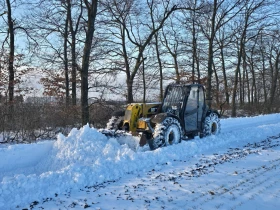 Телескопични товарачи Caterpillar TH 407, снимка 1