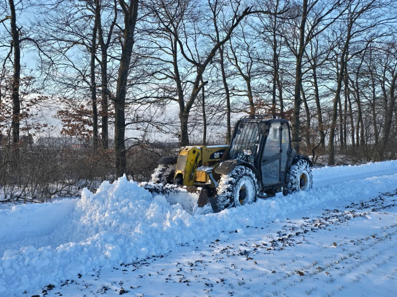 Телескопични товарачи Caterpillar TH 407