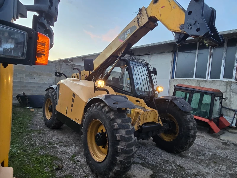 Телескопични товарачи Caterpillar TH 407