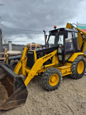 Багер Cat 438B 4x4 - изображение 1