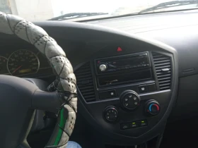 Kia Carens, снимка 11