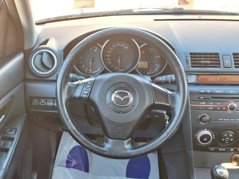 Mazda 3 1.4 i, снимка 13 - Автомобили и джипове - 48103598