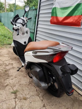     Kymco People GT 300 sport.