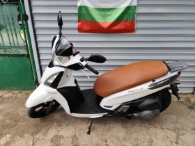     Kymco People GT 300 sport.