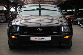     Ford Mustang GT V8  ~24 900 .