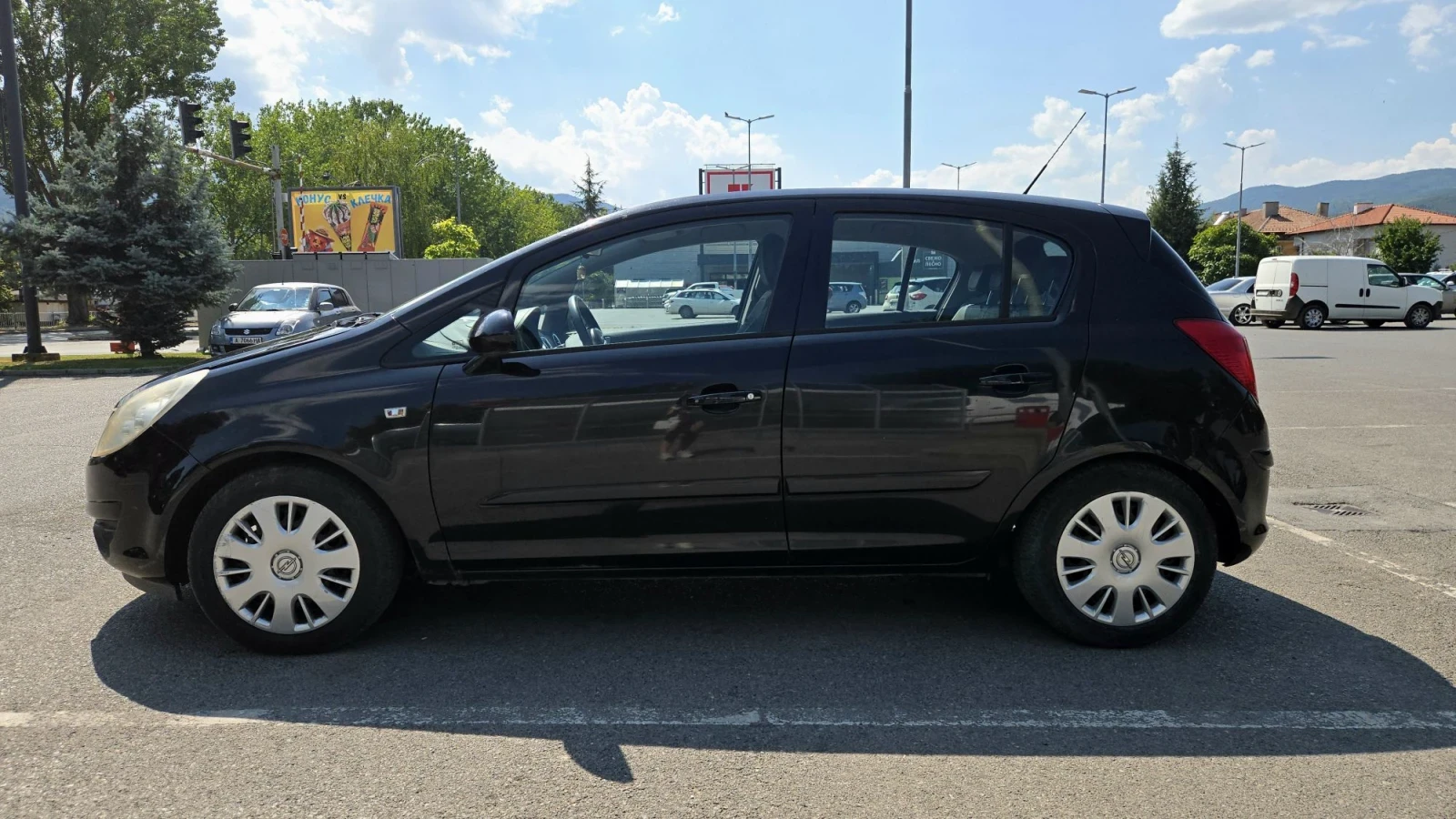 Opel Corsa D 1.4i, снимка 7 - Автомобили и джипове - 55778383