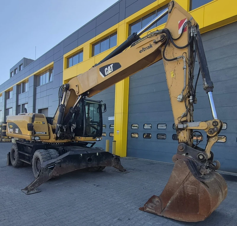 Багер Cat M322D