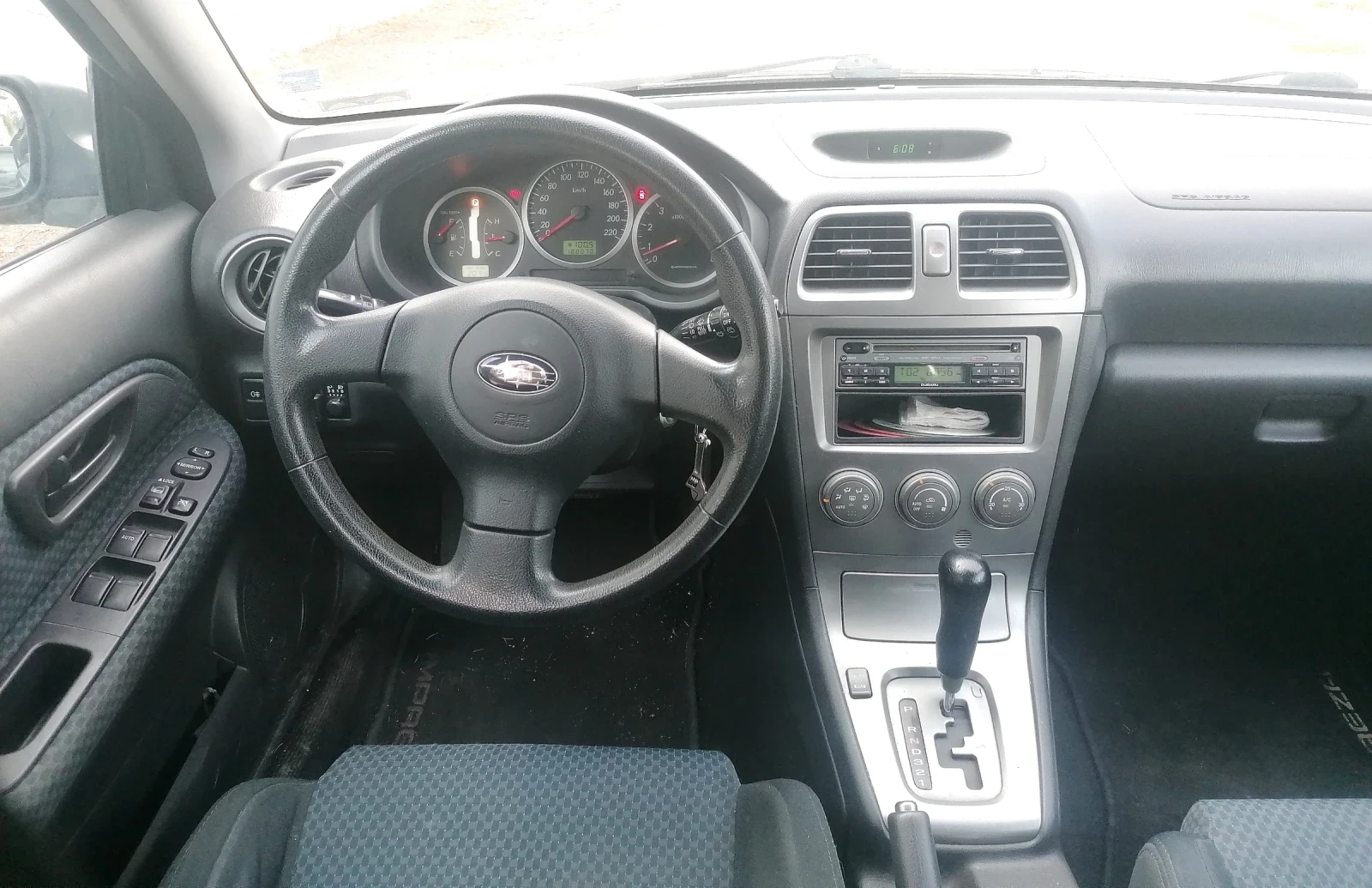 Subaru Impreza 1.6 автомат газ 4х4 - изображение 8